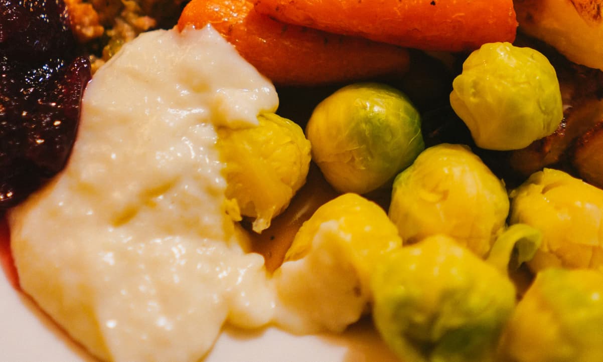 boiled brussel sprouts and a white sauce