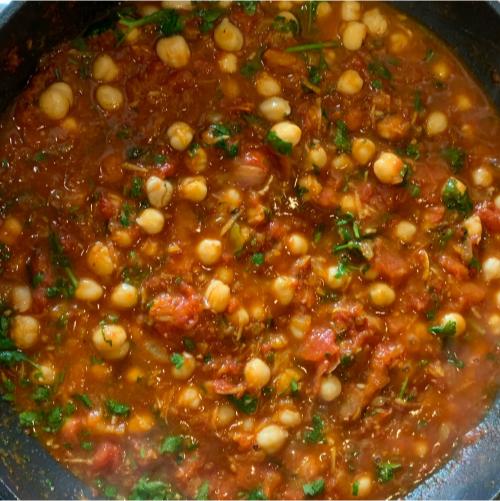 chickpea curry cooking in a pan