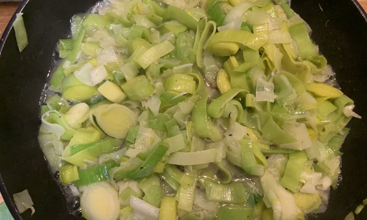 leeks cooking in a pan