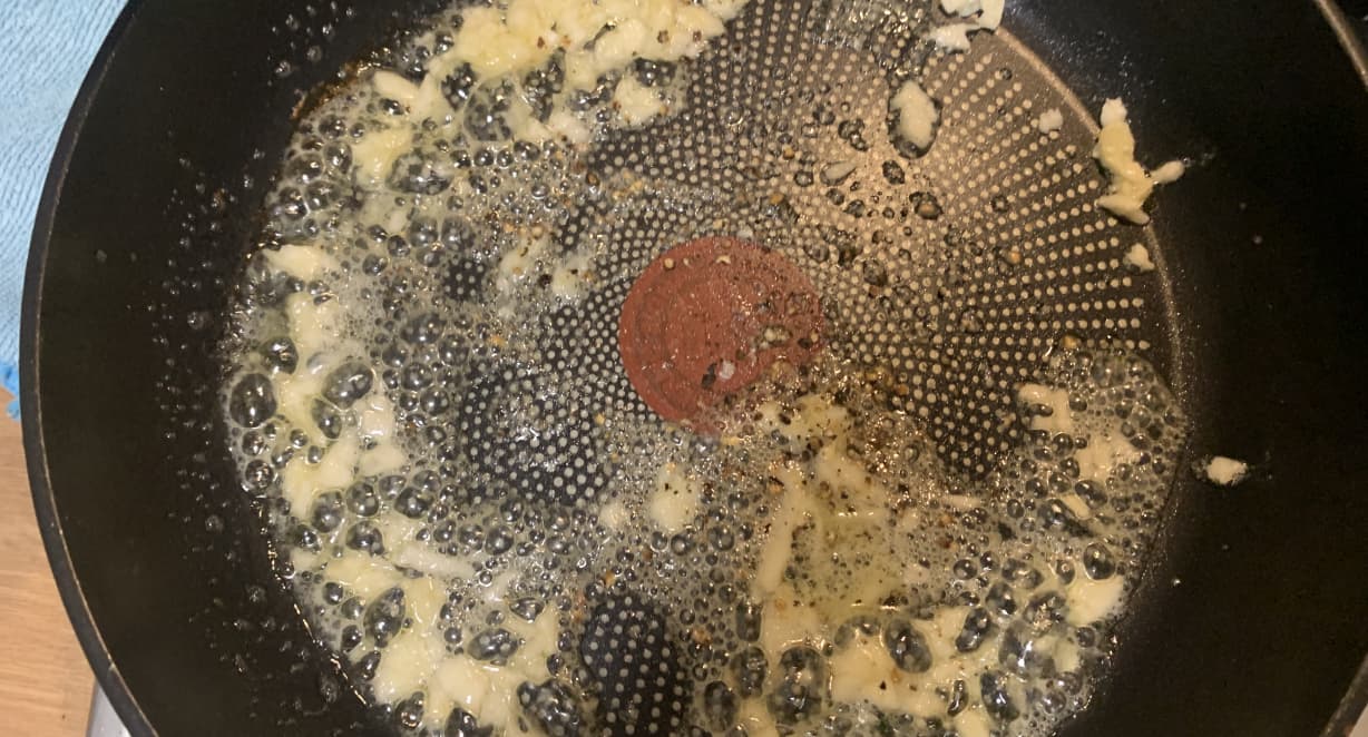 garlic frying in a pan