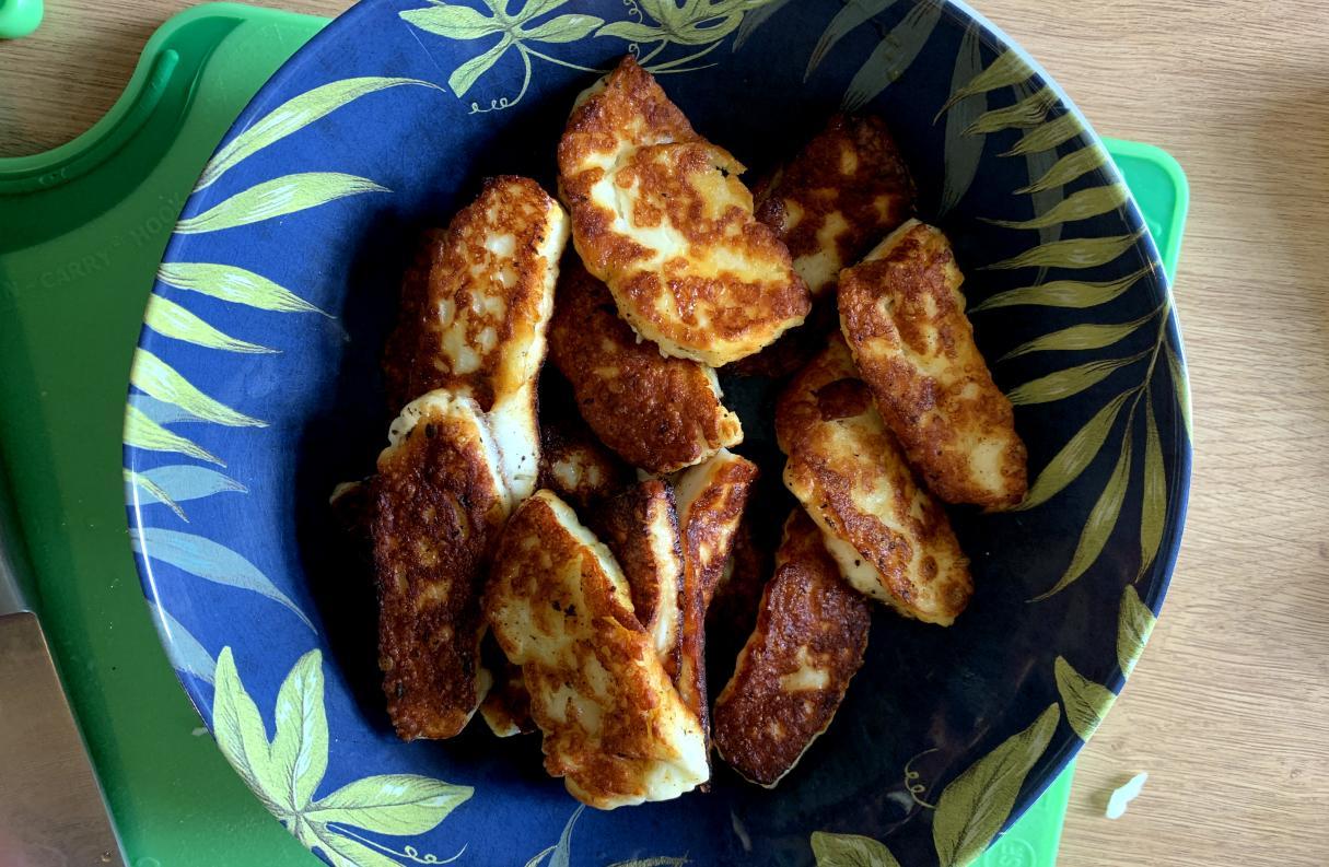 fried halloumi slices in a bowl