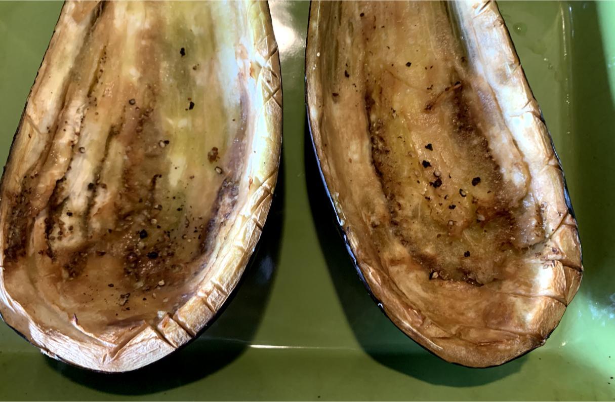 lightly cooked hollowed out aubergine halves