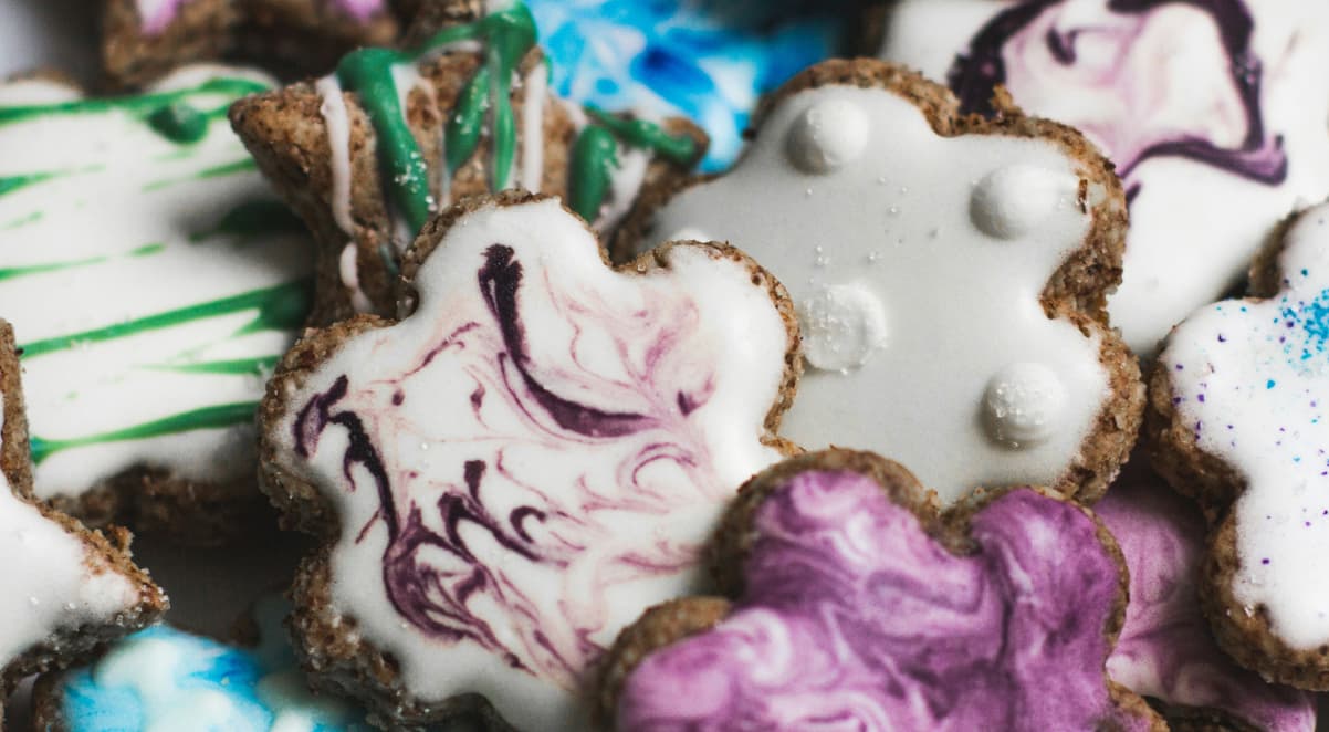 a closeup of iced, colourful biscuits shaped like stars