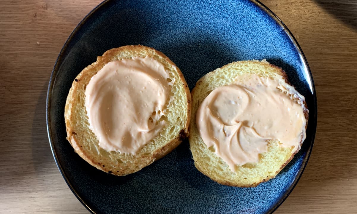 light pink sriracha mayo on a brioche bun