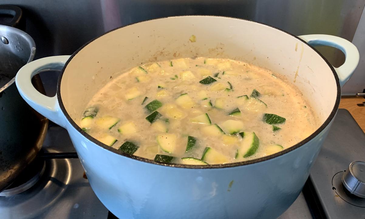 courgette cubes floating in a milky broth