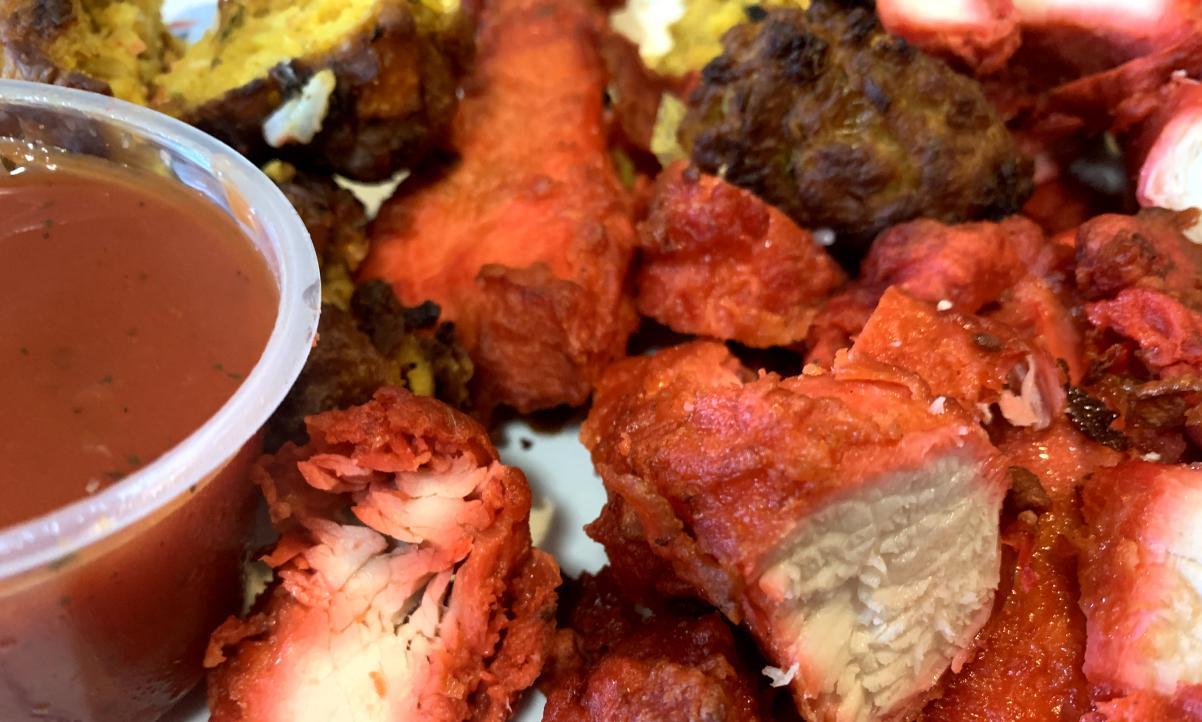 closeup of a plate of chicken and veg pakora