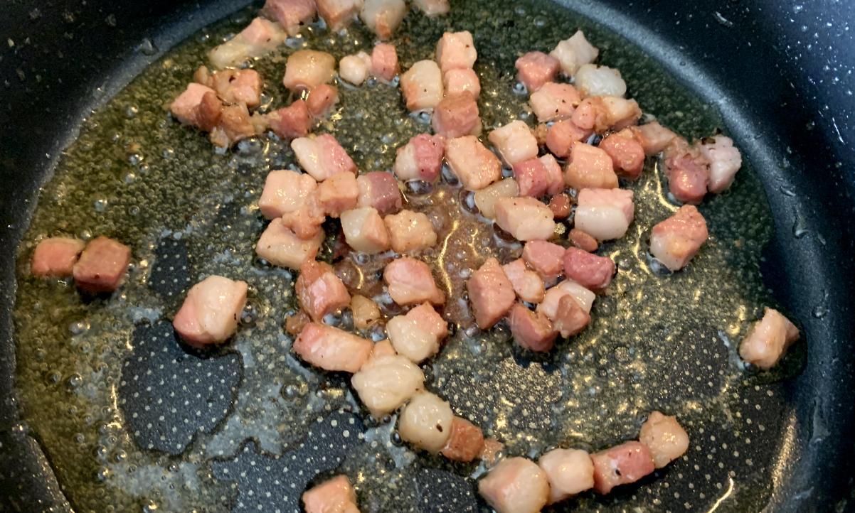 smoked pancetta frying in olive oil