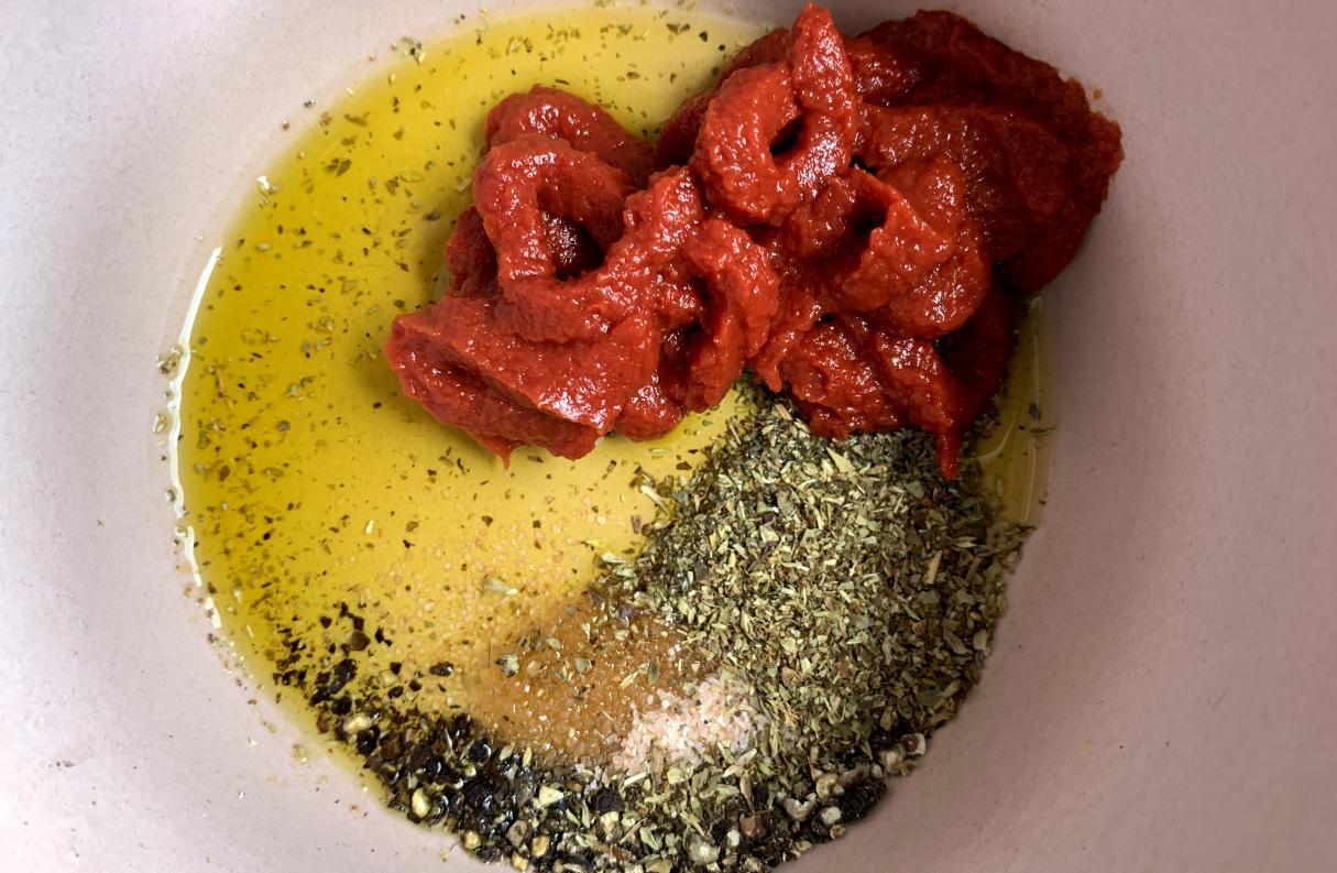 olive oil, cracked black pepper, pink salt and dried oregano in a bowl