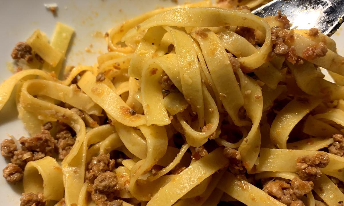 close-up of Ferrarese ragu served with tagliatelle