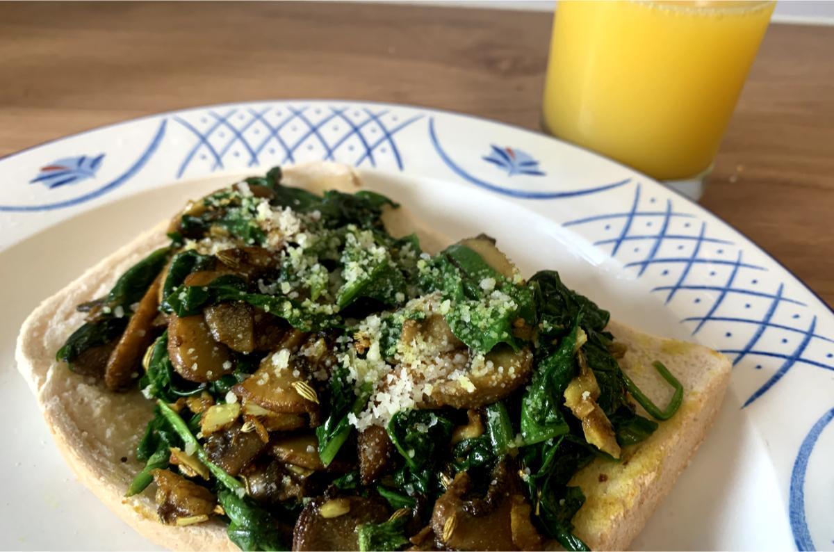 spinach and mushroom toast dusted with pecorino