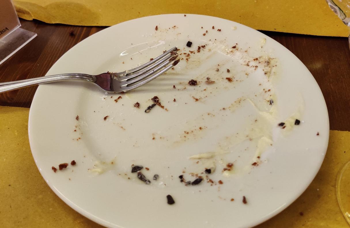 a plate empty apart from some chocolate cake crumbs