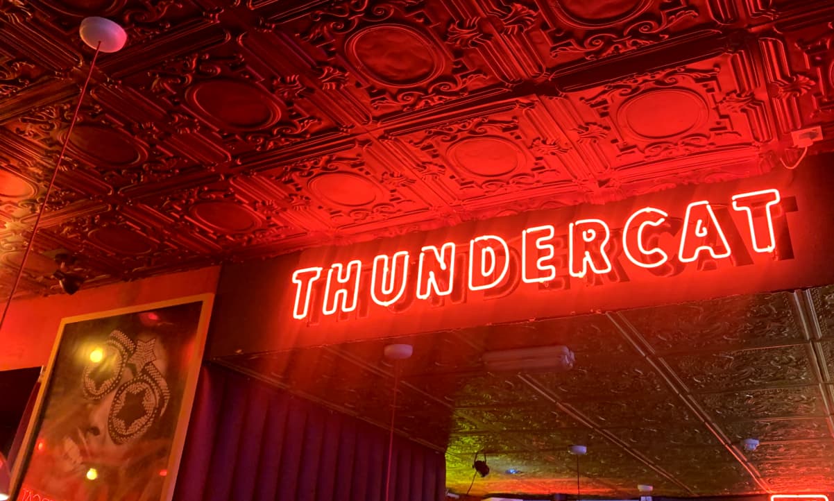 the word 'THUNDERCAT' written in neon on the ceiling of Thundercat, Glasgow