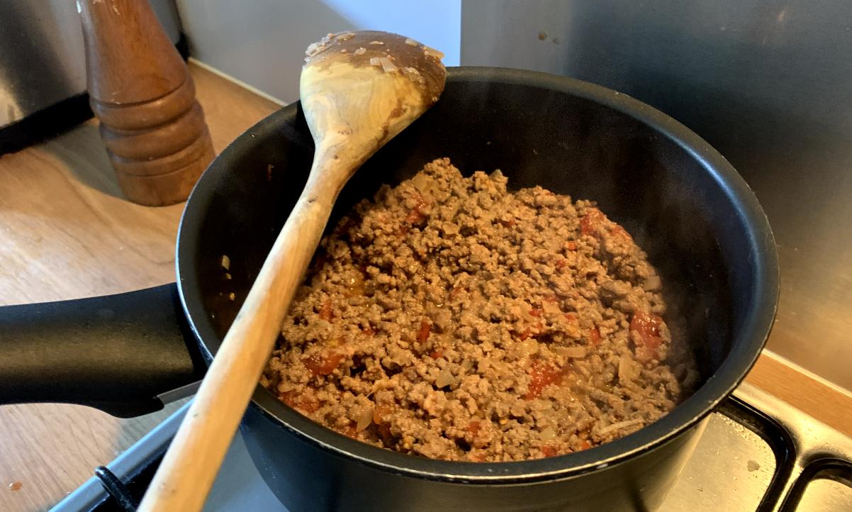 mince and tomatoes cooking in a pot