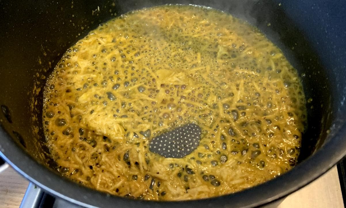 garlic and fennel frying in a pan