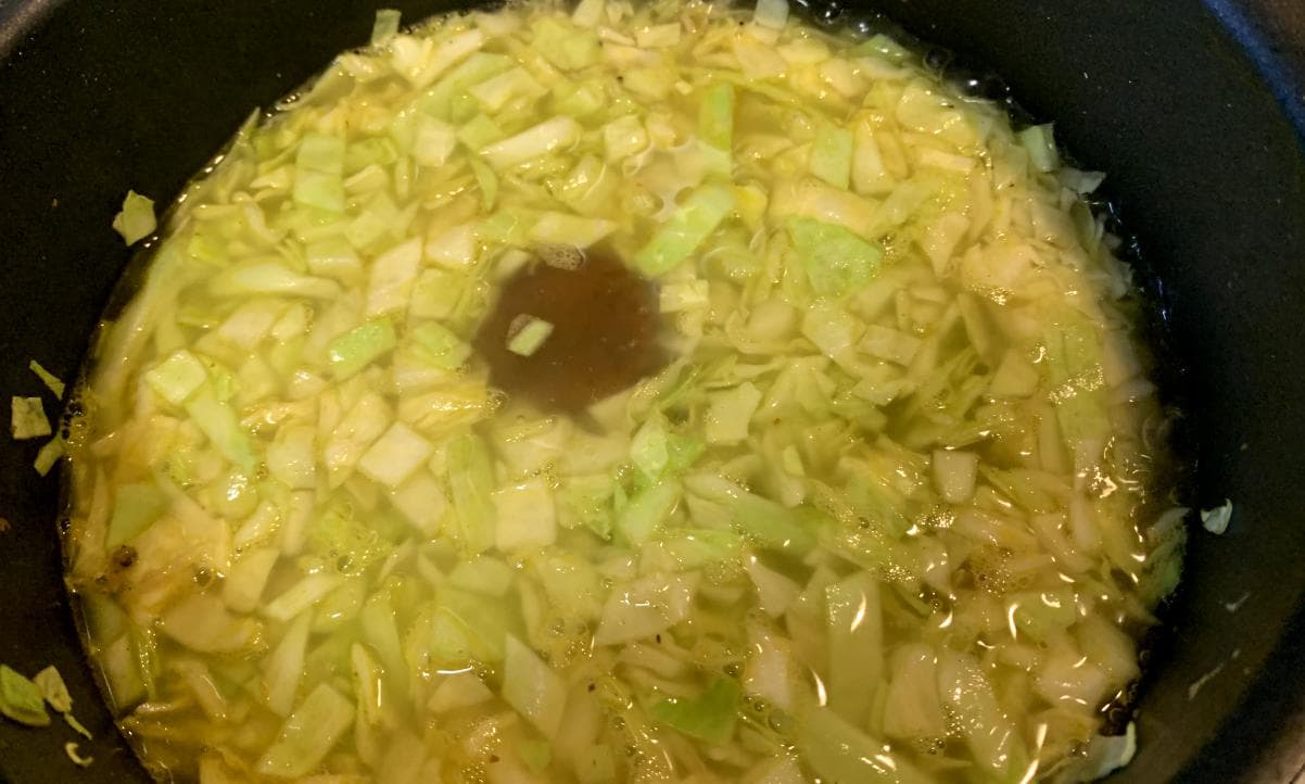 cabbage, water and a stock pot in a pot